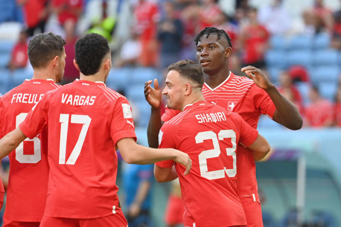 Xherdan Shaqiri (no.23) pictured hugging Breel Embolo following the striker's winning goal for Switzerland against Cameroon at the 2022 FIFA World Cup in Qatar